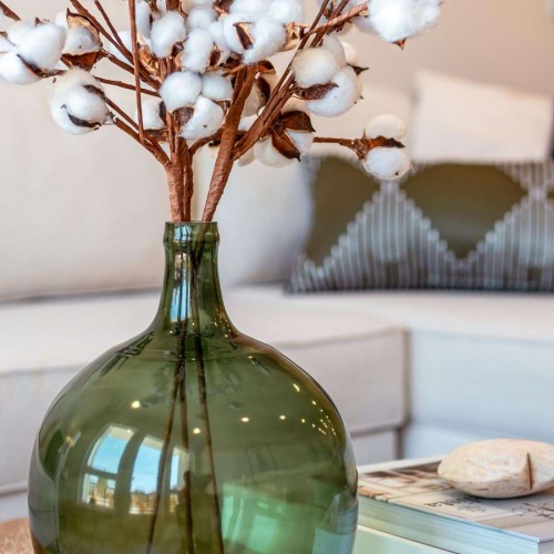 a vase with white flowers on a table