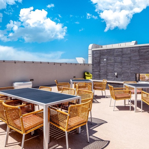 Take advantage of all Province has to offer a group of chairs and tables outside