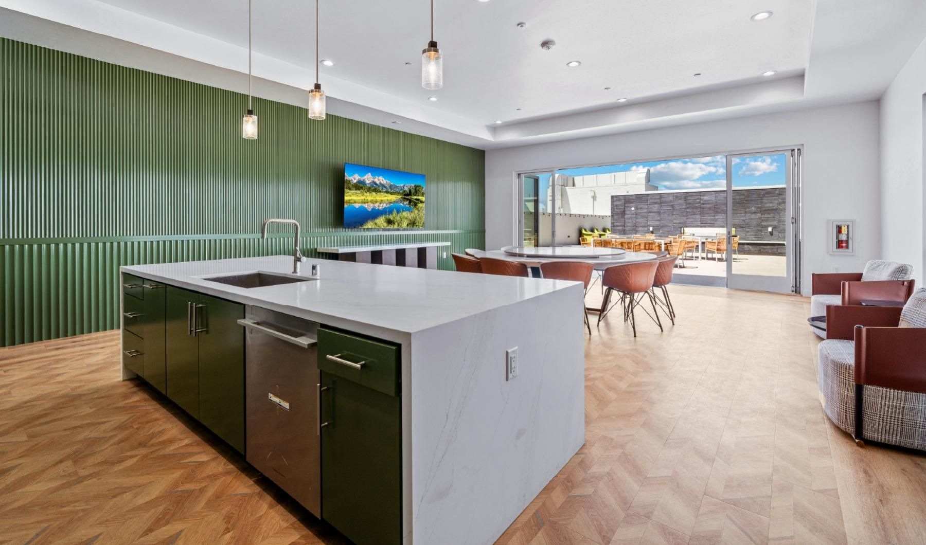 State-of-the-art amenities Clubhouse with indoor-outdoor gathering space and kitchen island at Province apartments for rent in San Gabriel, CA.