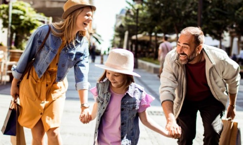 Settle into comfort at Province Stock photo of a family walking on a sidewalk close by our apartments near Arcadia and Alhambra, CA.